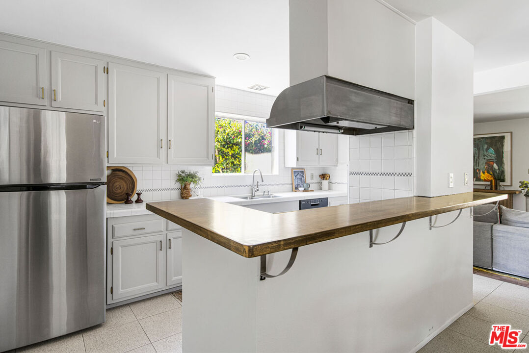 2015 Panamint Drive Los Angeles, CA 90065 - Photo 10 of 29 a kitchen with stainless steel appliances a sink stove and refrigerator