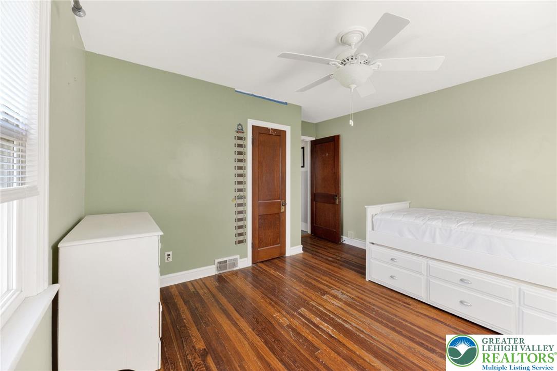5370 Hanoverville Road Bethlehem, PA 18017 - Photo 11 of 24 a bedroom with a bed and a ceiling fan