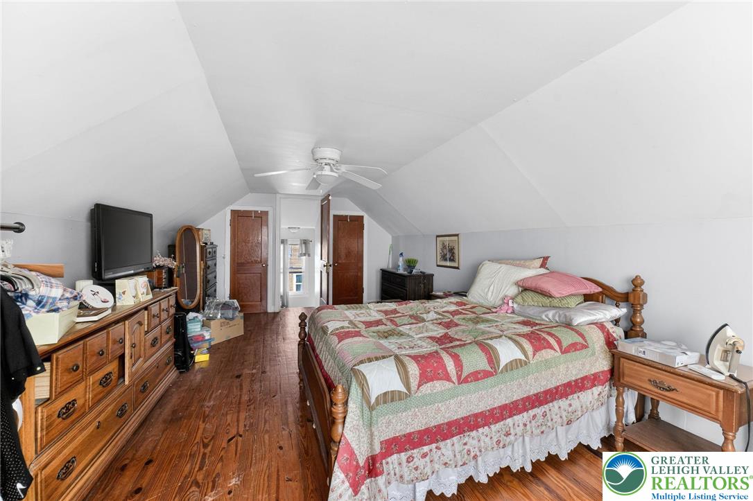 5370 Hanoverville Road Bethlehem, PA 18017 - Photo 14 of 24 a bedroom with a bed and a flat tv screen on a dresser