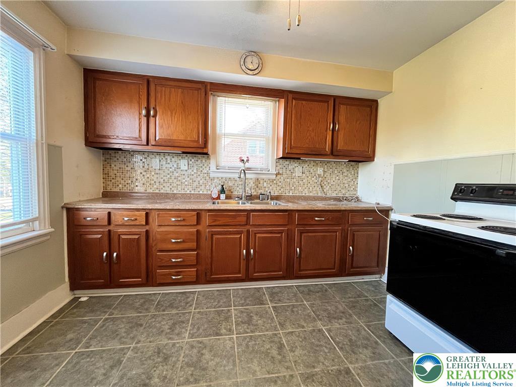 5370 Hanoverville Road Bethlehem, PA 18017 - Photo 8 of 24 a kitchen with a sink a stove and cabinets