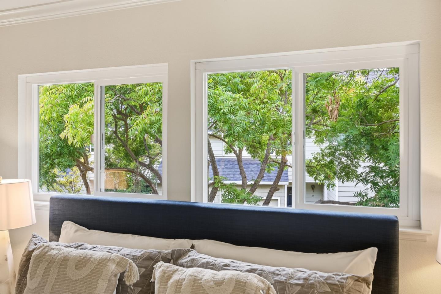 181 Ada Avenue, Unit 29 Mountain View, CA 94043 - Photo 14 of 30 a bed sitting in a bedroom next to a window