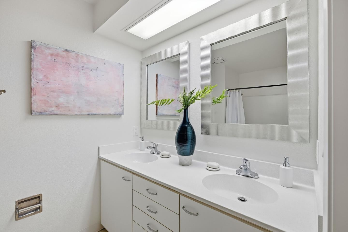 181 Ada Avenue, Unit 29 Mountain View, CA 94043 - Photo 20 of 30 a bathroom with a double vanity sink and a mirror