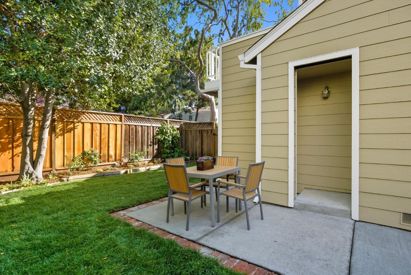 181 Ada Avenue, Unit 29 Mountain View, CA 94043 - Photo 24 of 30 a view of a house with backyard and a sitting area