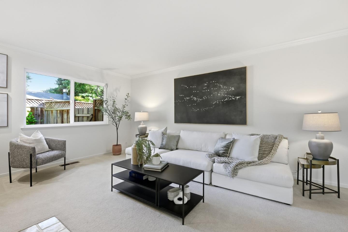 181 Ada Avenue, Unit 29 Mountain View, CA 94043 - Photo 4 of 30 a living room with furniture a large window and a flat screen tv