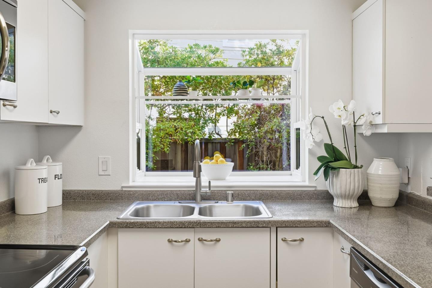 181 Ada Avenue, Unit 29 Mountain View, CA 94043 - Photo 7 of 30 a kitchen with a sink and window