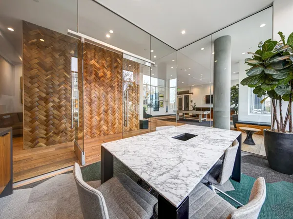 a kitchen with a table and chairs in it