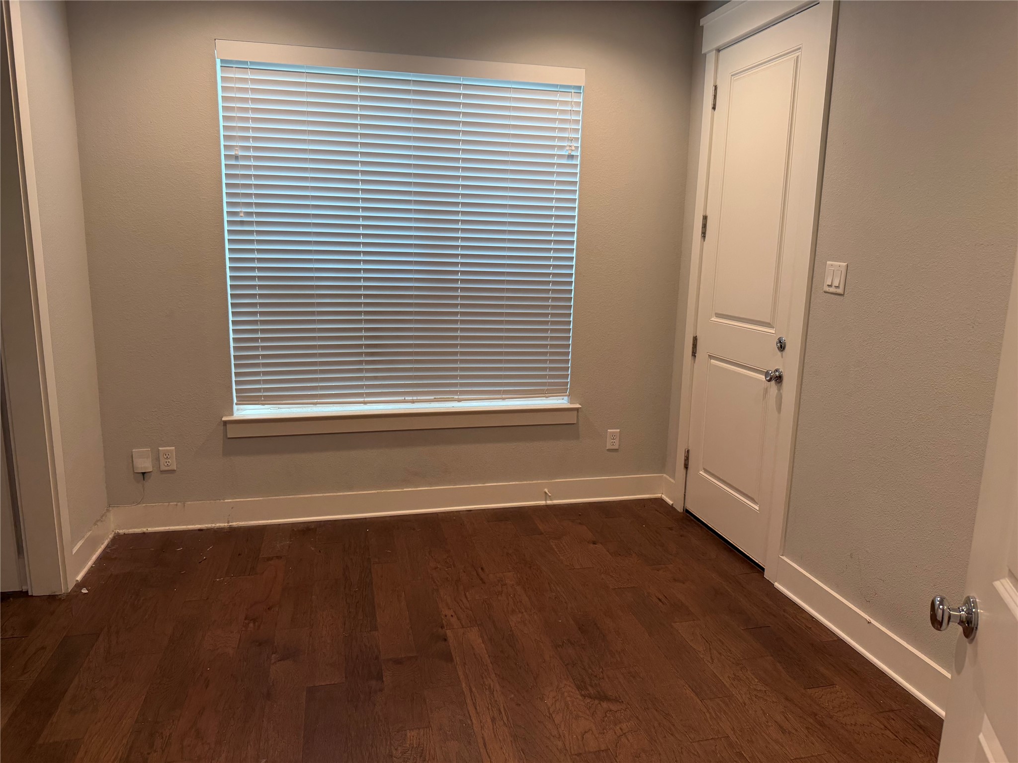 902 Martin Street, Unit A Houston, TX 77018 - Photo 13 of 21 an empty room with wooden floor and a window