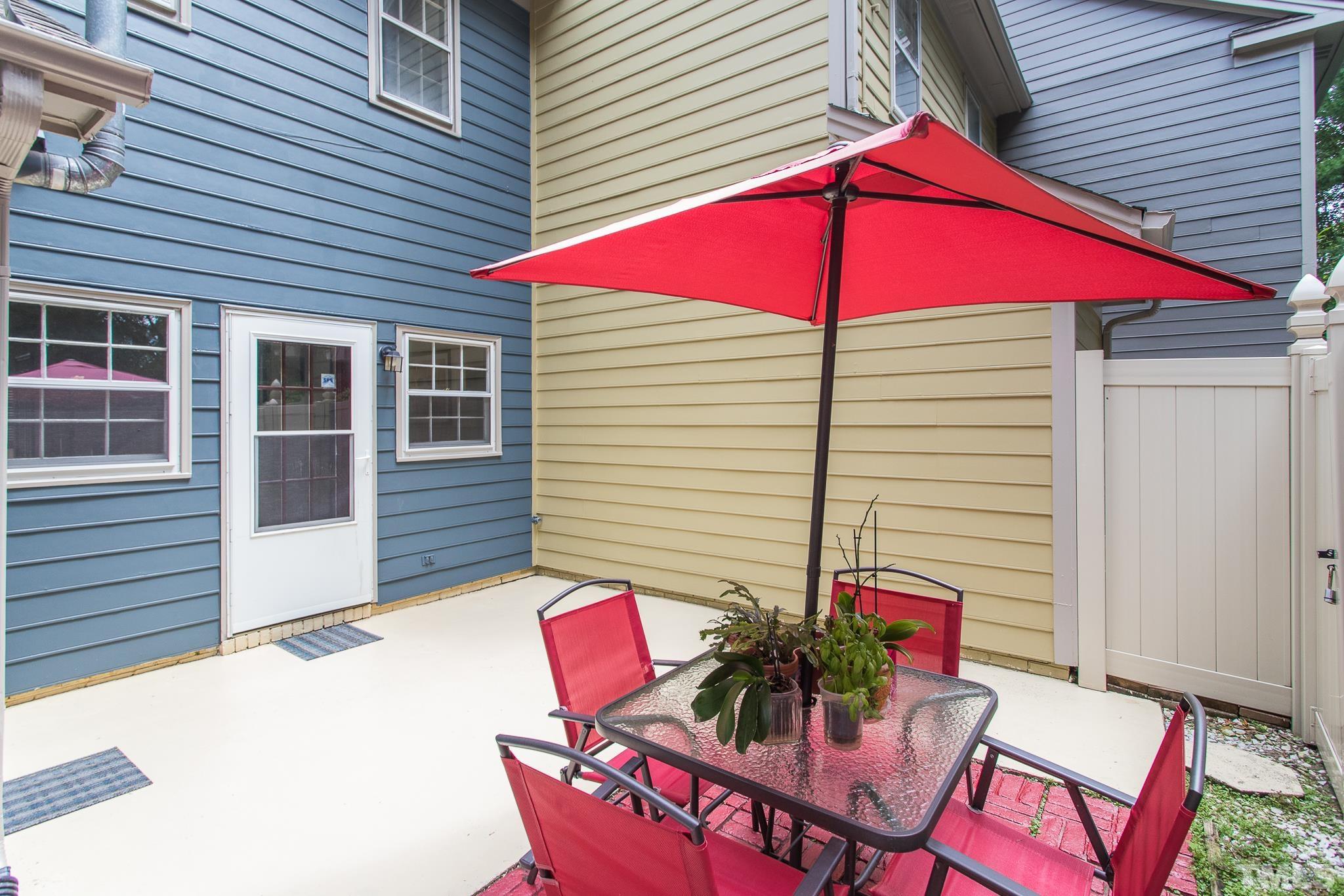 2923 Faversham Place Raleigh, NC 27604 - Photo 17 of 21 a balcony with table and chairs