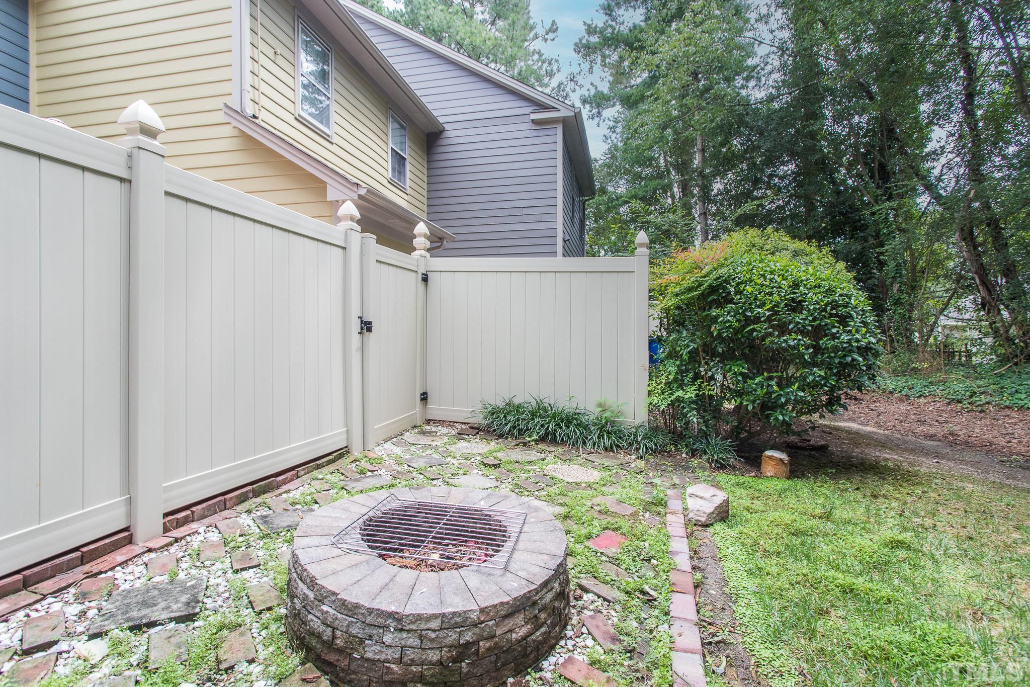 2923 Faversham Place Raleigh, NC 27604 - Photo 20 of 21 a view of a backyard with plants and entertaining space