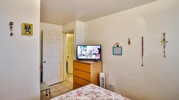 a view of a room that has a table and chairs in it