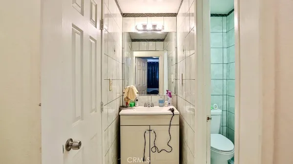 a bedroom with a bed and a tv