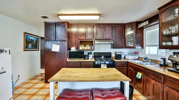 a kitchen with a table and chairs