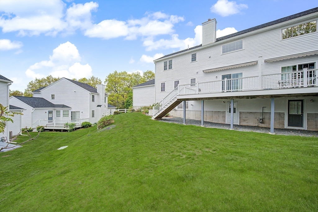 3 Oak View Terrace, Unit 3 Franklin, MA 02038 - Photo 31 of 38 a view of a white house with a big yard and large trees