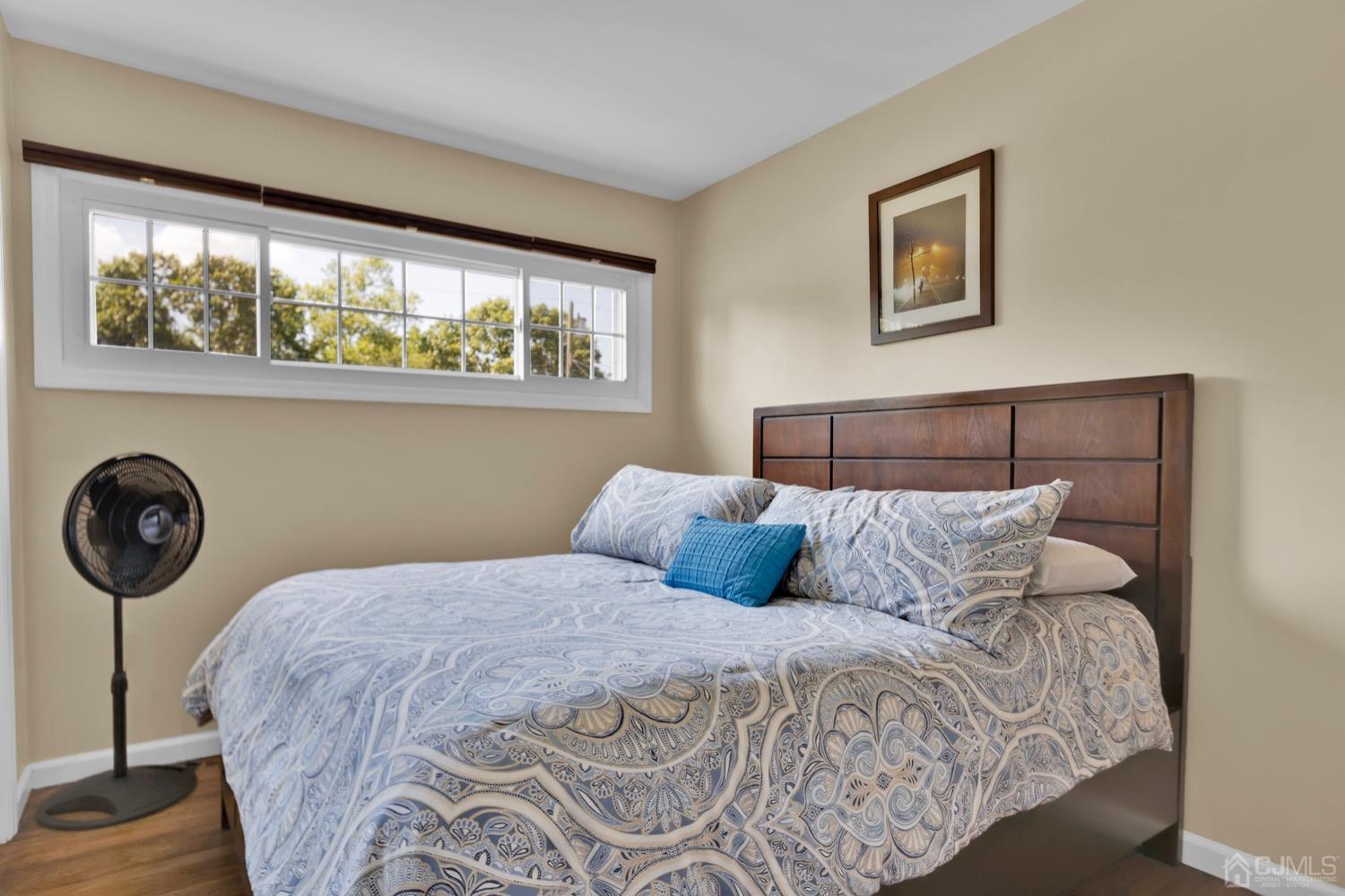 10 Rutgers Road Old Bridge, NJ 08859 - Photo 11 of 18 a bedroom with a bed a wall painting and a window