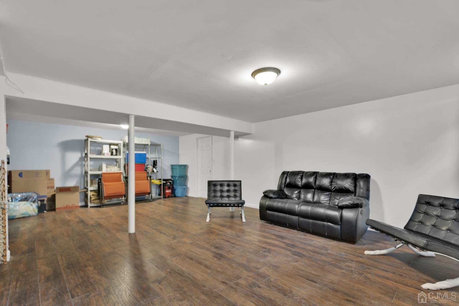 10 Rutgers Road Old Bridge, NJ 08859 - Photo 15 of 18 a living room with furniture and a wooden floor