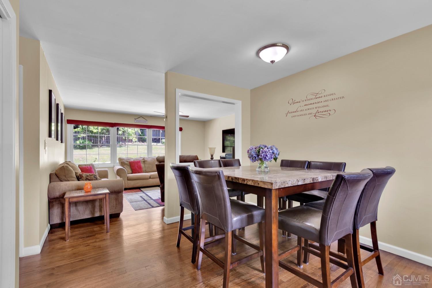 10 Rutgers Road Old Bridge, NJ 08859 - Photo 3 of 18 a view of a dining room with furniture and a floor to ceiling window