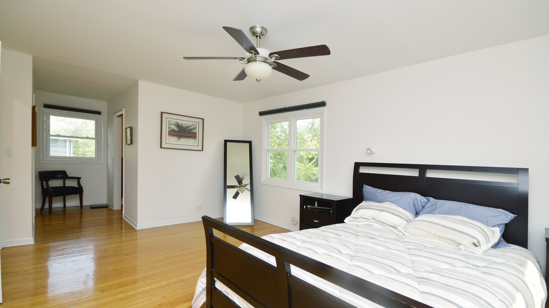 1809 Winnetka Road Northfield, IL 60093 - Photo 14 of 27 a bedroom with a large bed and a window