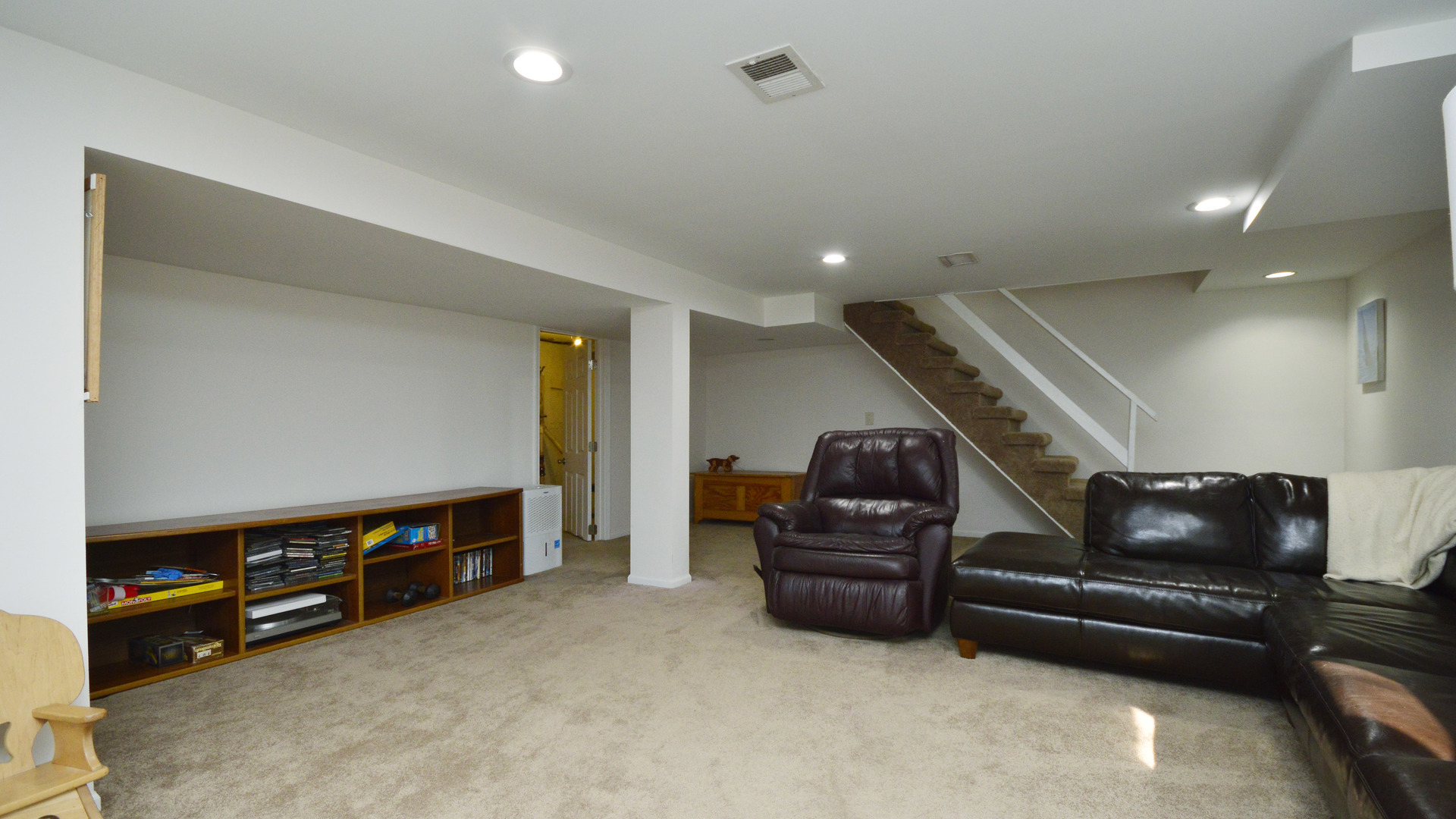 1809 Winnetka Road Northfield, IL 60093 - Photo 22 of 27 a living room with furniture and a flat screen tv