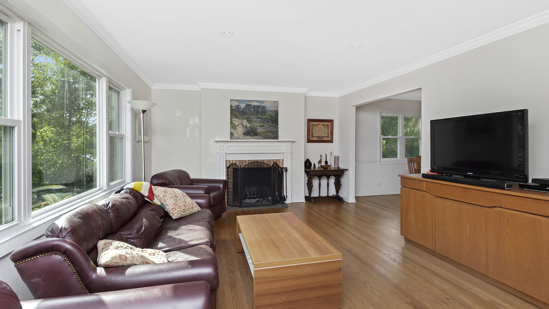 1809 Winnetka Road Northfield, IL 60093 - Photo 5 of 27 a living room with furniture a flat screen tv and a fireplace