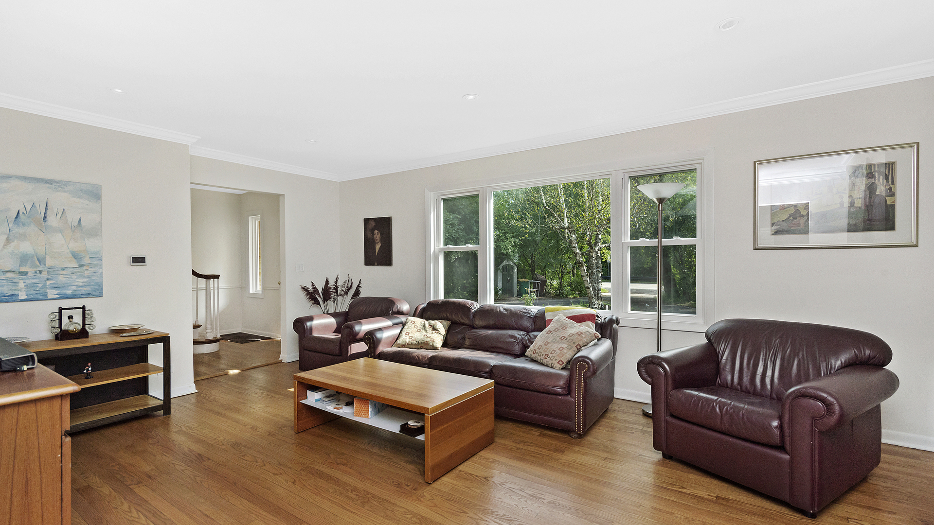 1809 Winnetka Road Northfield, IL 60093 - Photo 6 of 27 a living room with furniture a large window and a wooden floor