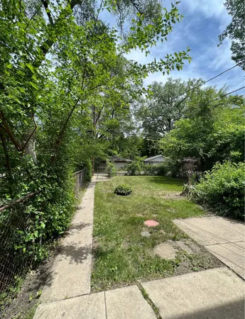 a view of a garden with a fountain