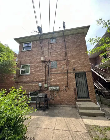 a backyard of a house with sofas