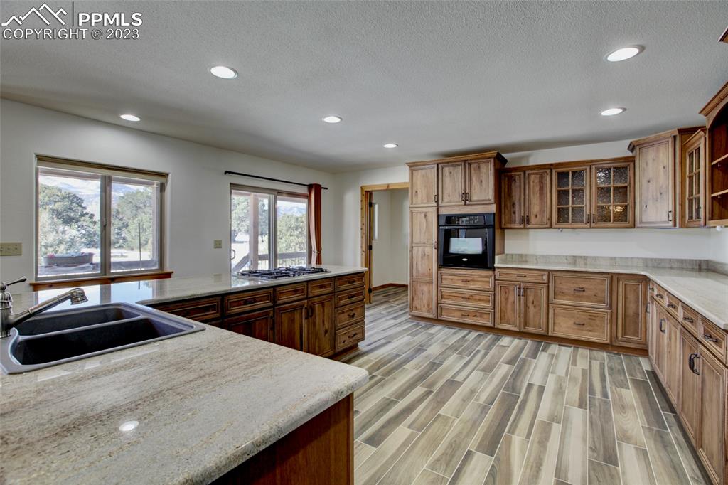 1001 Three Streams Road Howard, CO 81233 - Photo 11 of 49 a kitchen with stainless steel appliances granite countertop a stove and a sink