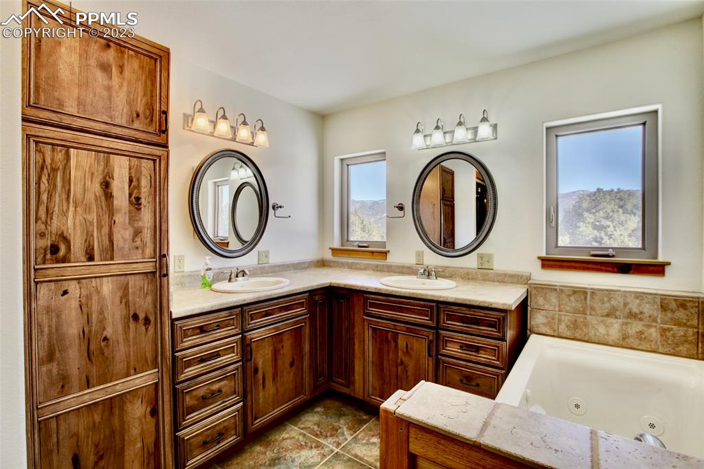 1001 Three Streams Road Howard, CO 81233 - Photo 21 of 49 a bathroom with a sink a toilet and a mirror