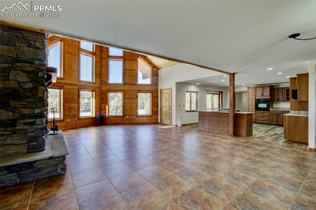 1001 Three Streams Road Howard, CO 81233 - Photo 5 of 49 a view of an empty room with kitchen view and a window