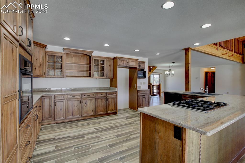 1001 Three Streams Road Howard, CO 81233 - Photo 9 of 49 a kitchen with stainless steel appliances granite countertop a sink and a stove