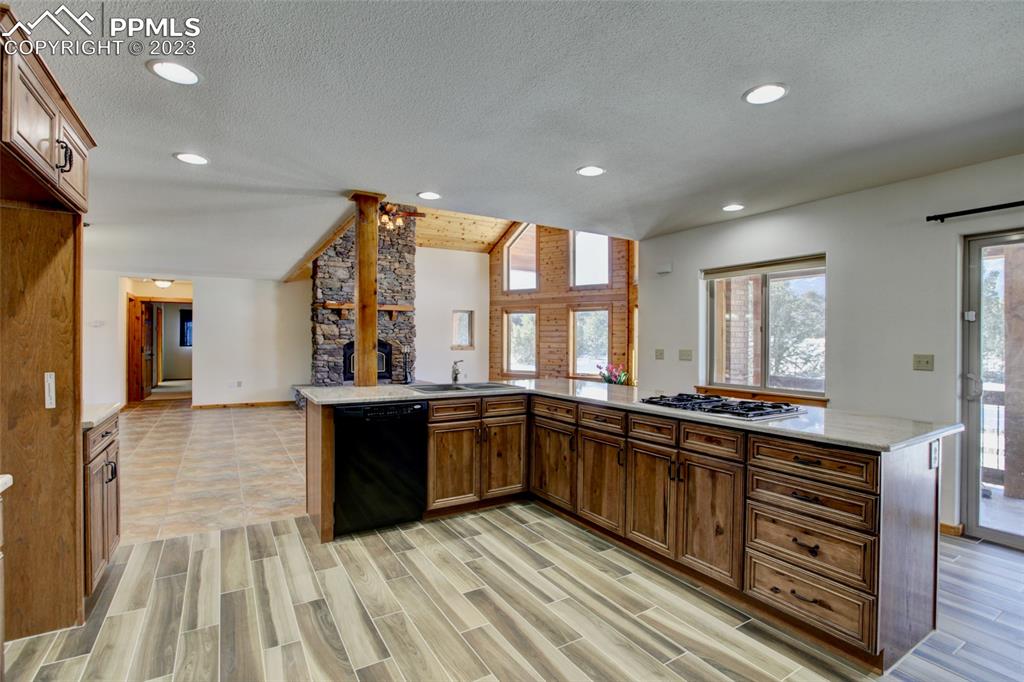 1001 Three Streams Road Howard, CO 81233 - Photo 10 of 49 a large kitchen with stainless steel appliances granite countertop a large counter top and stove