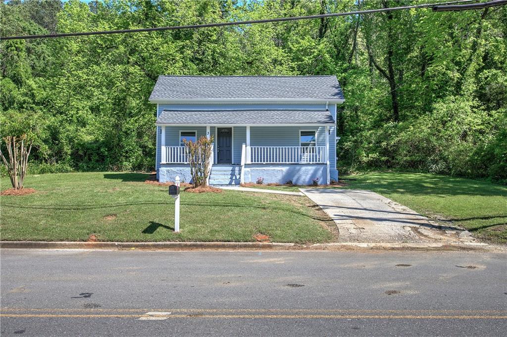 3 Blacks Bluff Road Southwest Rome, GA 30161 - Photo 1 of 1 a view of a house with a yard plants and a large tree