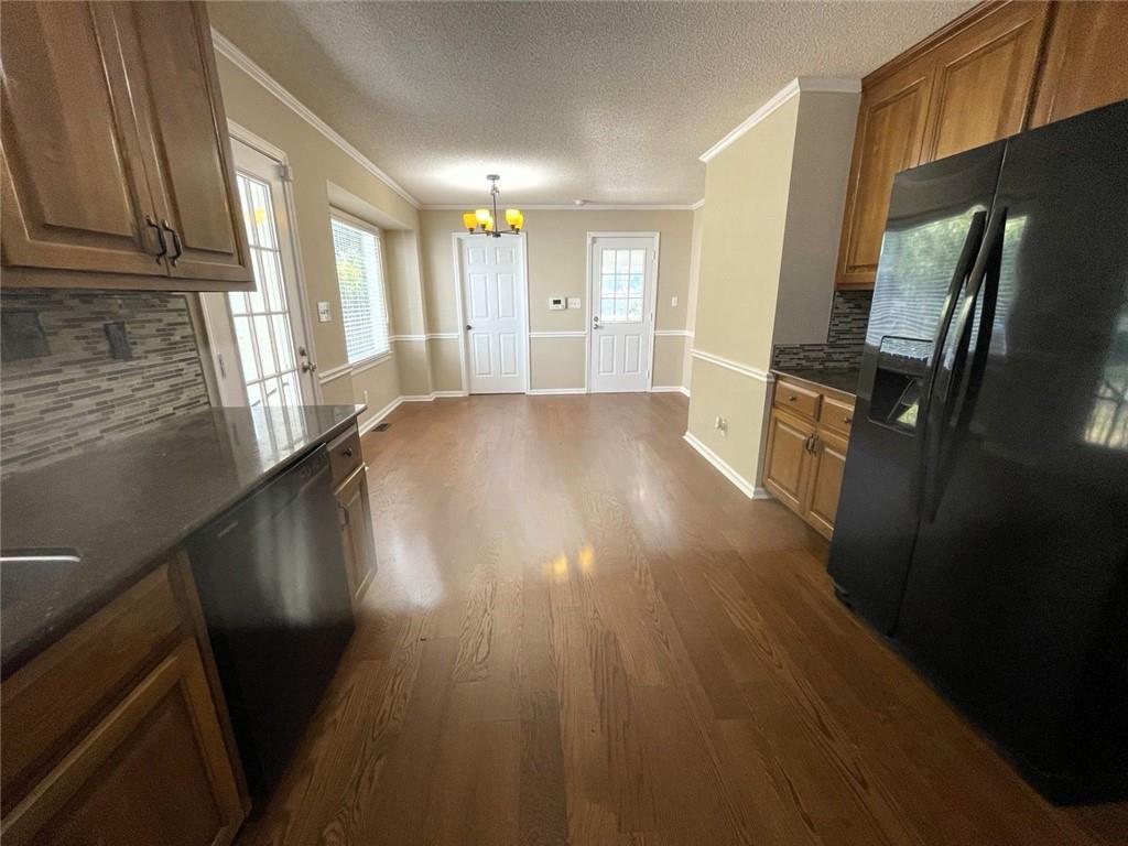 31 Williamsburg Drive Northwest Rome, GA 30165 - Photo 17 of 33 a view of an empty room with wooden floor and a window