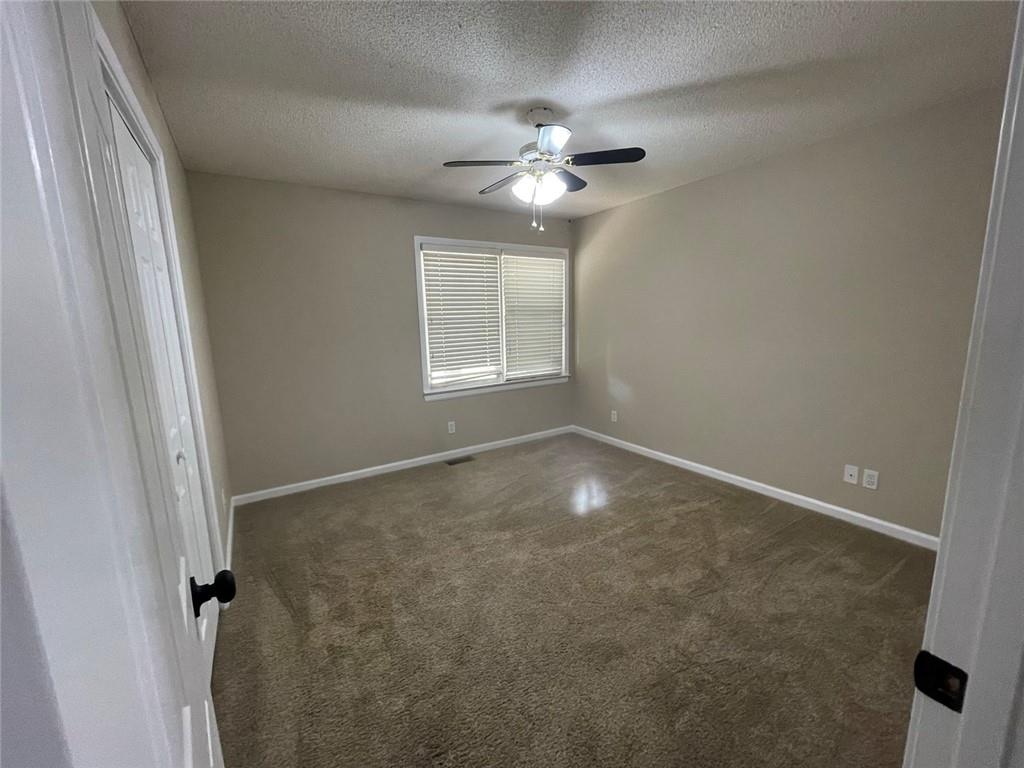 31 Williamsburg Drive Northwest Rome, GA 30165 - Photo 21 of 33 a view of a livingroom with a ceiling fan and window