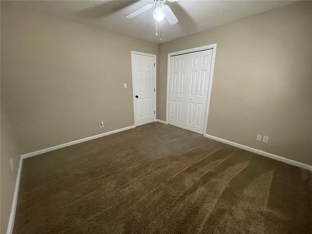 31 Williamsburg Drive Northwest Rome, GA 30165 - Photo 23 of 33 an empty room with a chandelier fan