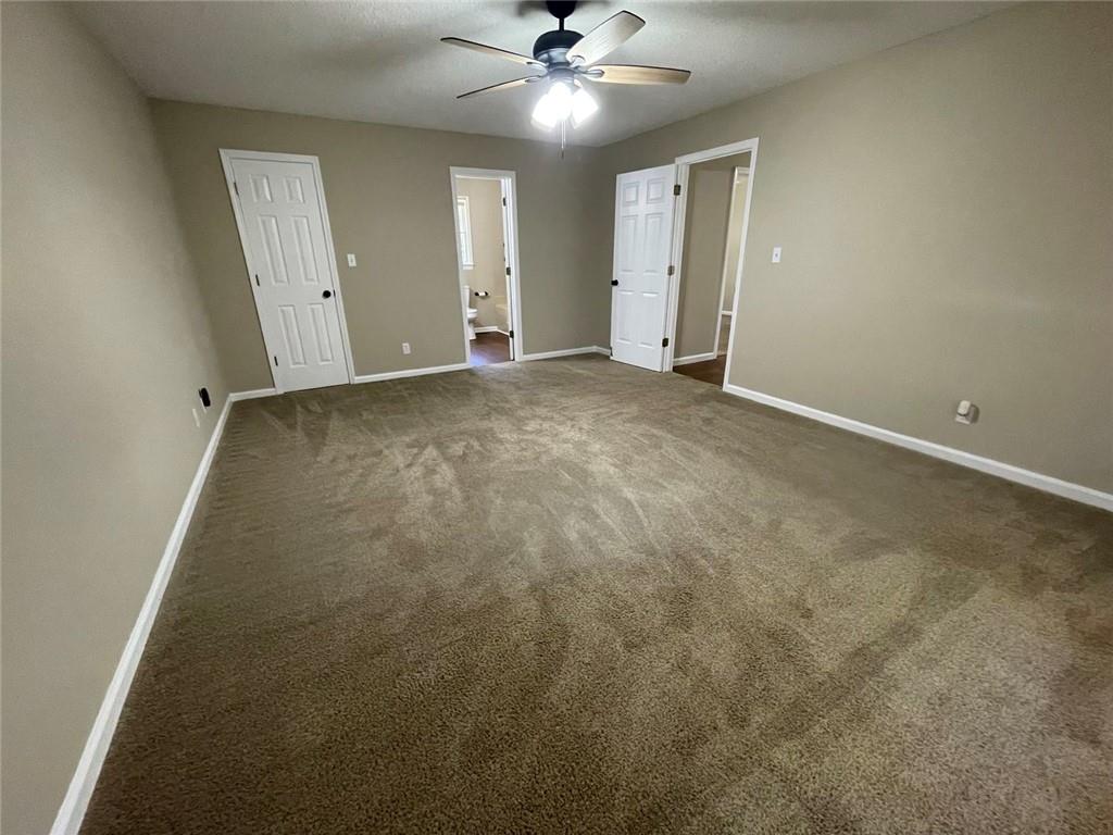 31 Williamsburg Drive Northwest Rome, GA 30165 - Photo 30 of 33 an empty room with a ceiling fan and a window