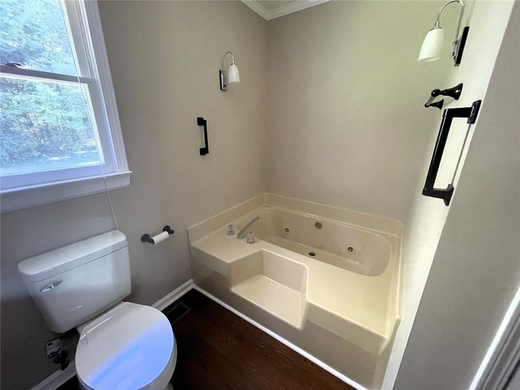 31 Williamsburg Drive Northwest Rome, GA 30165 - Photo 32 of 33 a bathroom with a toilet sink and mirror
