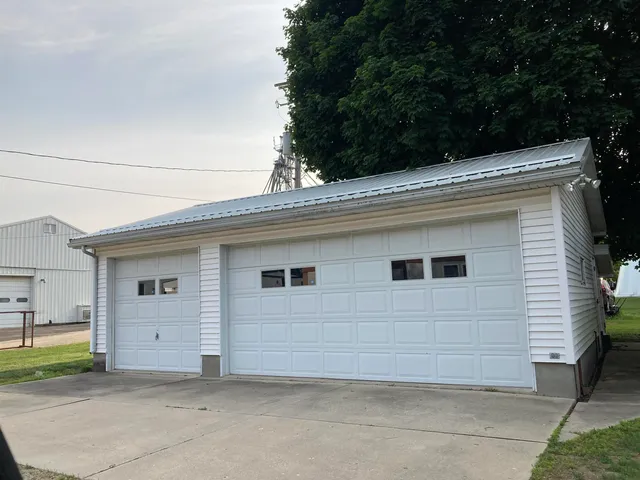 a view of a house with a backyard