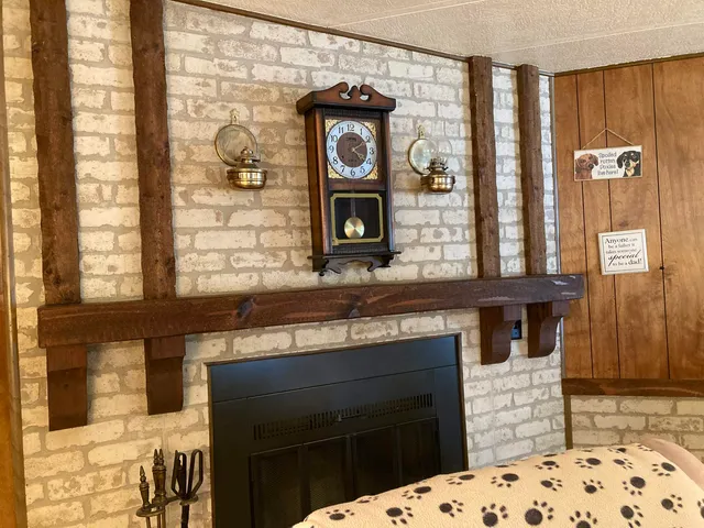 a hallway with fireplace and window