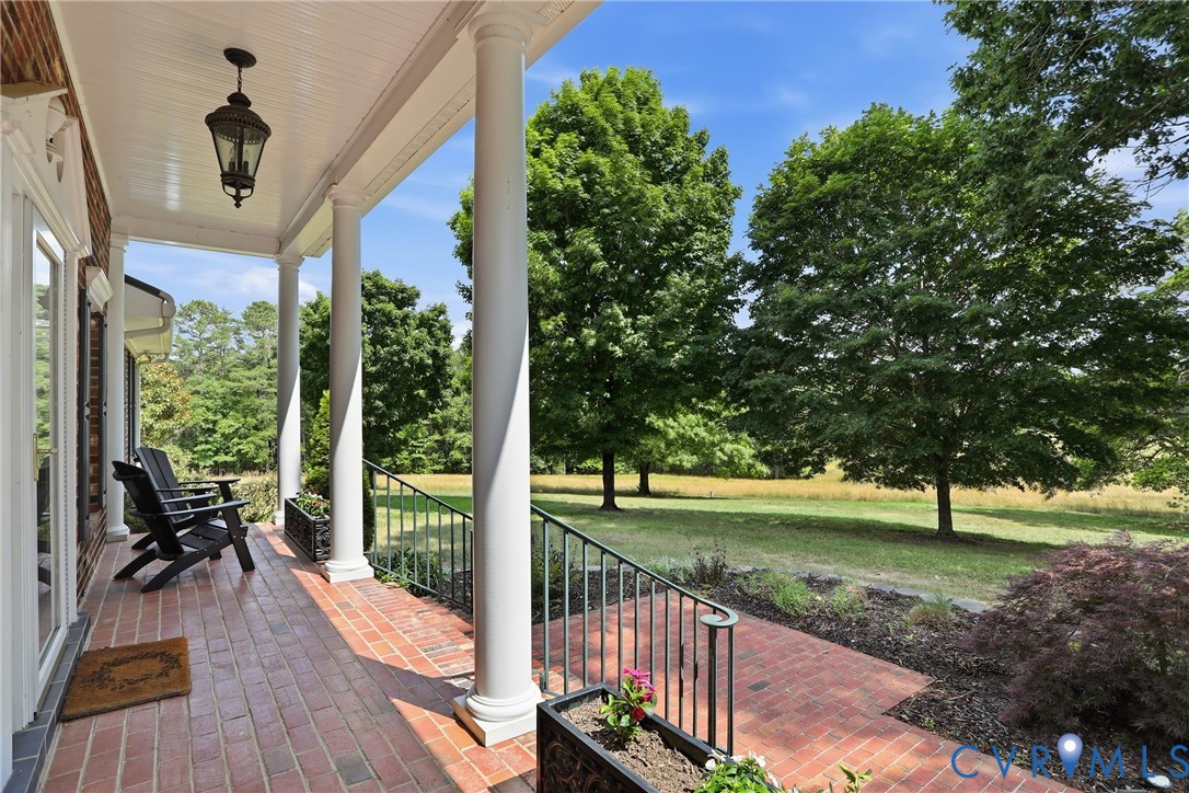 13300 West Patrick Henry Road Doswell, VA 23047 - Photo 46 of 69 Expansive covered porch featuring a brick floor, w