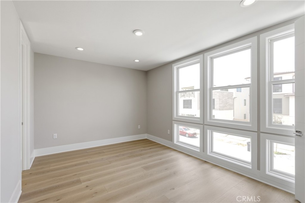 156 Apron Irvine, CA 92618 - Photo 25 of 40 wooden floor in an empty room with a window