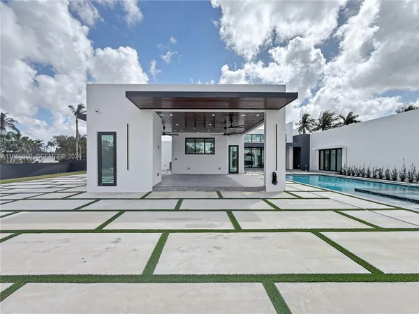 a view of a hallway with a glass door and deck