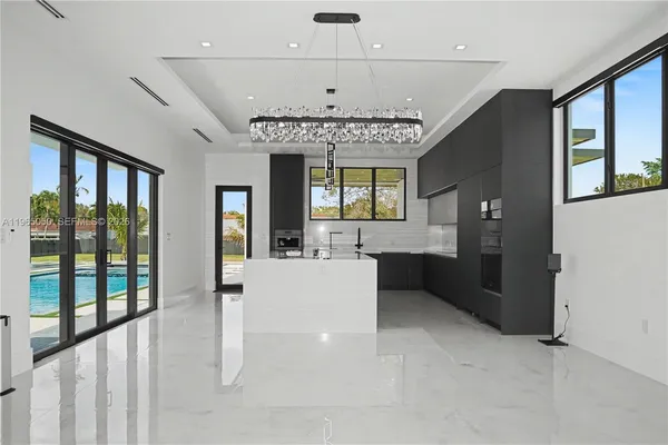 an empty room with windows and entrance