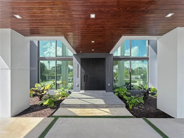 a building with car parked in front of it