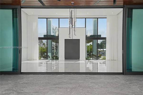 a bathroom with a double vanity sink a toilet and shower