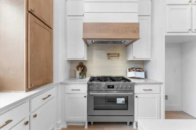 a view of a kitchen area with furniture window and wooden floor