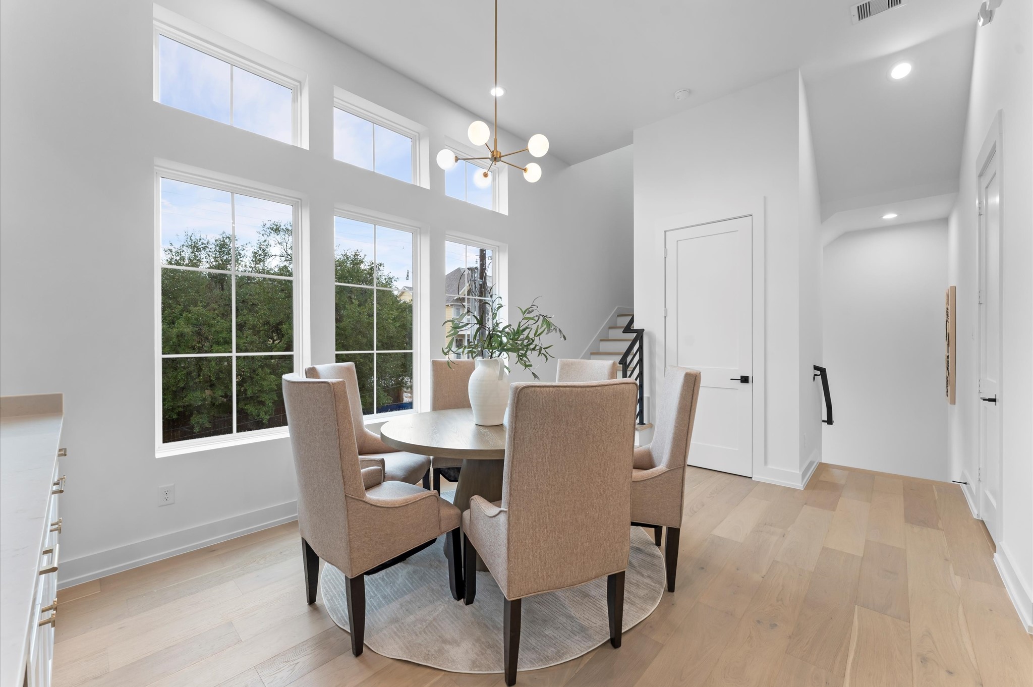 2928 Michaux Street Houston, TX 77009 - Photo 9 of 44 Second floor dining with elevator shaft between stairs.