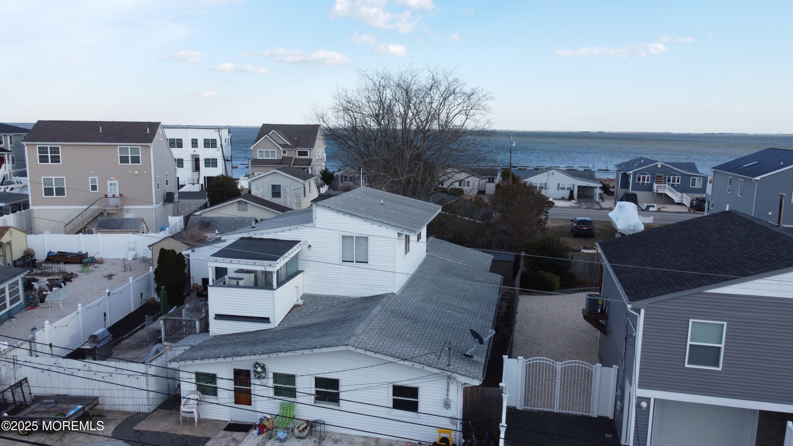 an aerial view of a house with parking space