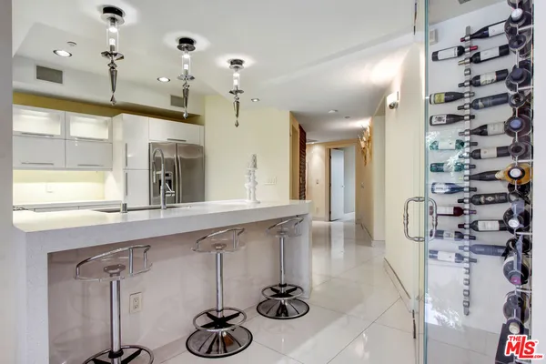 a kitchen with refrigerator and window