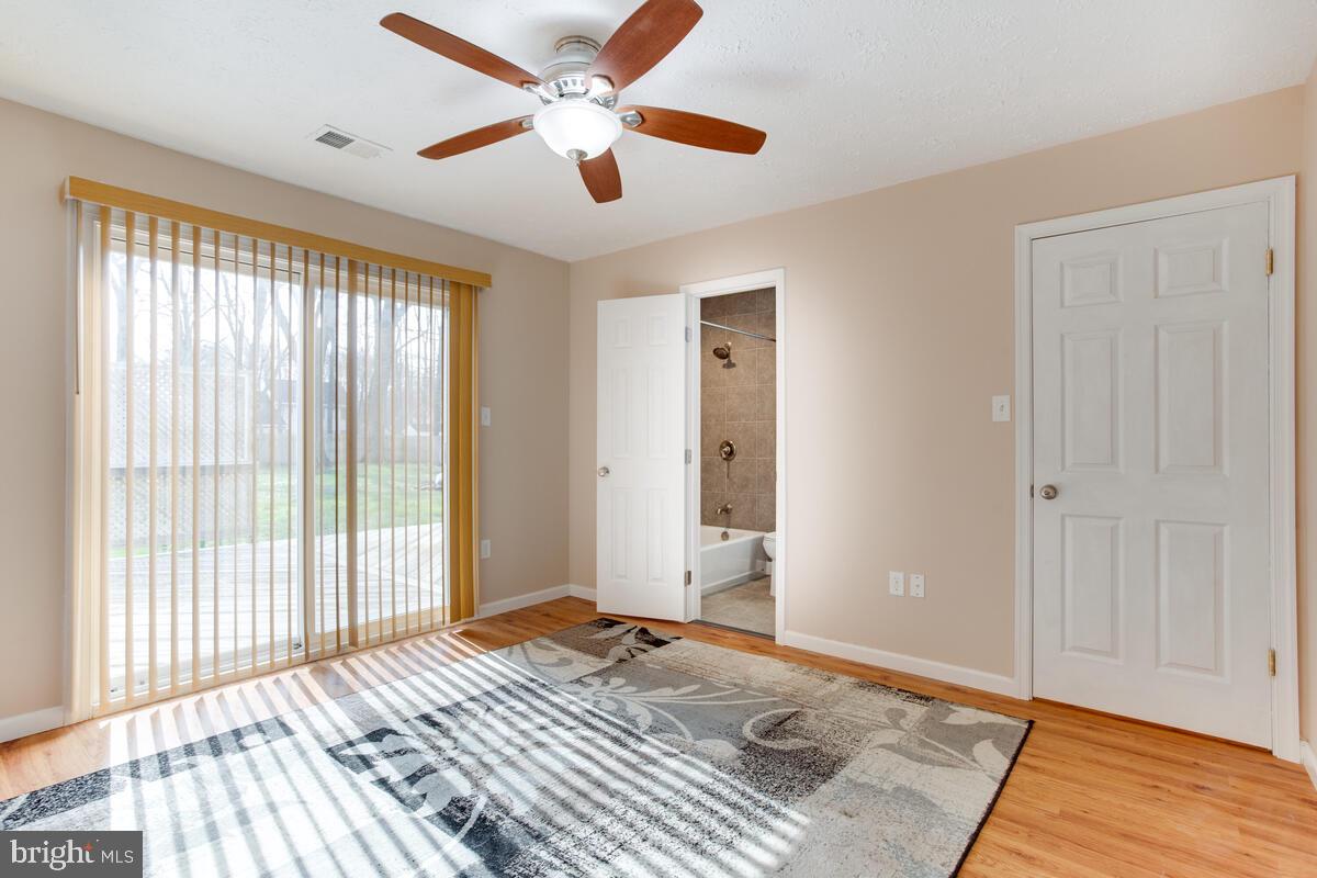 622 Old Love Point Road Stevensville, MD 21666 - Photo 11 of 38 Main Bedroom has access to the back yard, Bathrm